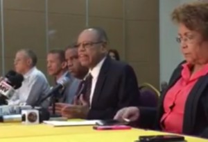 Lidio Cadet y otros miembros de la Comisión Electoral del PLD en rueda de prensa.