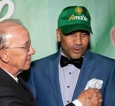Amable Aristy Castro y felix Jerez (con gorra).